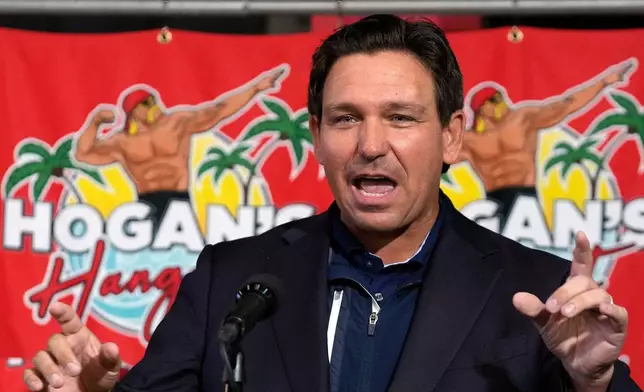 Florida Gov. Ron DeSantis speaks during a news conference after naming a trail in honor of wrestling legend Hulk Hogan Friday, Oct. 3, 2025, in Clearwater, Fla. (AP Photo/Chris O'Meara)