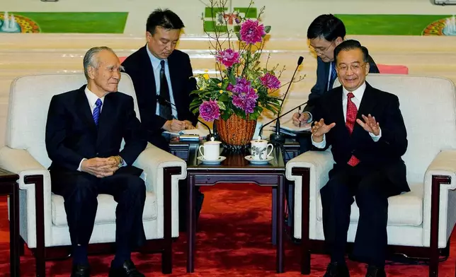 FILE - Chinese Premier Wen Jiabao, right, meets former Japanese Prime Minister Murayama Tomiichi before a banquet to commemorate the 35th anniversary of the normalization of Sino-Japanese relations at the Great Hall of the People on Sept. 27, 2007, in Beijing. (Andrew Wong/Pool Photo via AP, File)