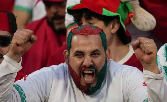 A Morocco fan cheers during the FIFA U-20 World Cup final soccer match against Argentina in Santiago, Chile, Sunday, Oct. 19, 2025. (AP Photo/Esteban Felix)