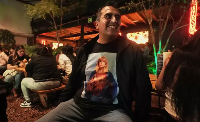 Fans gather to celebrate the release of Taylor Swift's new album, "The Life of a Showgirl" in Mexico City, Thursday, Oct. 2, 2025. (AP Photo/Claudia Rosel)