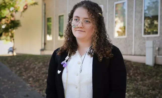 Animal rights activist Zoe Rosenberg, who is on trial for taking four chickens from one of Perdue Farms' major poultry plants, is pictured outside Sonoma County Superior Court in Santa Rosa, Calif. on Tuesday, Oct. 28, 2025. (AP Photo/Terry Chea)