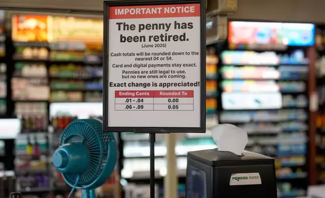 A sign in a Kwik Trip store shows the store will no longer be using pennies to give change, on Oct. 23, 2025, in Yorkville, Wis. (AP Photo/Morry Gash)