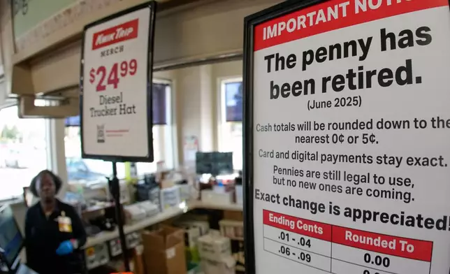 A sign in a Kwik Trip store shows the store will no longer be using pennies to give change, on Oct. 23, 2025, in Yorkville, Wis. (AP Photo/Morry Gash)