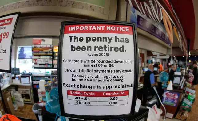 A sign in a Kwik Trip store shows the store will no longer be using pennies to give change, on Oct. 23, 2025, in Yorkville, Wis. (AP Photo/Morry Gash)