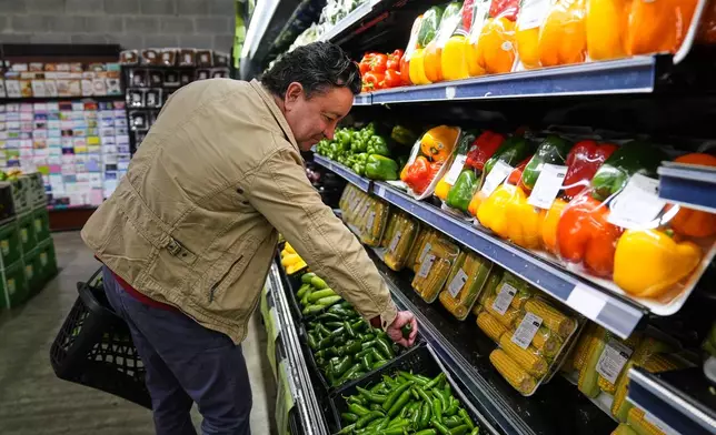 A person shops for produce, which is covered by the USDA Supplemental Nutrition Assistance Program (SNAP), at a grocery store in Baltimore, Thursday, Oct. 30, 2025. (AP Photo/Stephanie Scarbrough)