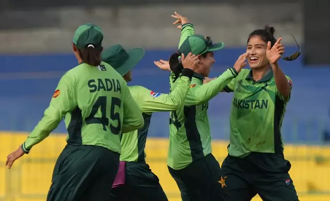 Pakistan's Nashra Sundhu celebrates the wicket of Australia's Tahlia McGrath during the ICC Women's Cricket World Cup match between Australia and Pakistan at Premadasa Stadium in Colombo, Sri Lanka, Wednesday, Oct, 8, 2025. (AP Photo/Eranga Jayawardena)