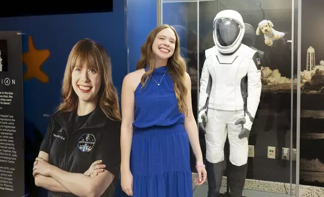 Hayley with her spacesuit at St. Jude Children's Research Hospital.