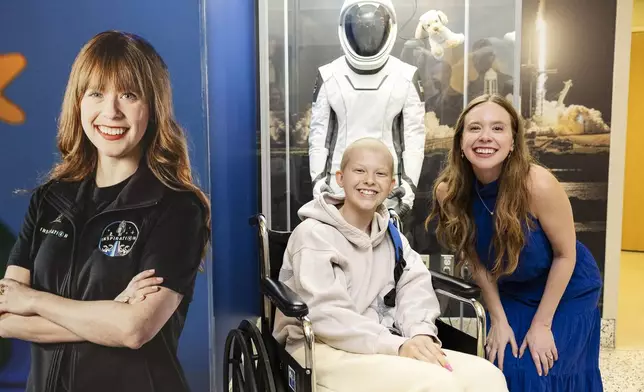 Hayley with St. Jude patient Faith at the unveiling of Hayley's spacesuit at St. Jude Children's Research Hospital.