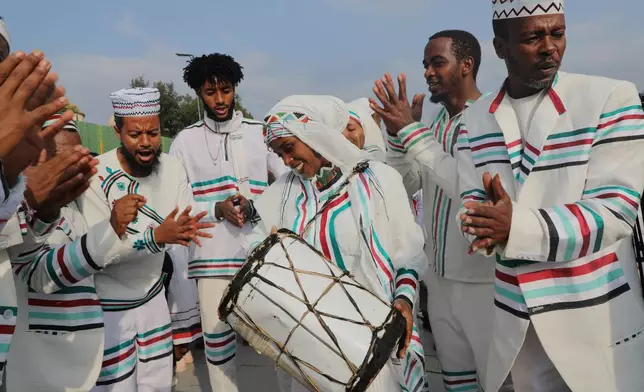 People attend the annual thanksgiving celebrations in Addis Ababa, Ethiopia, Saturday, Oct 4, 2025. (AP Photo/Amanuel Birhane)