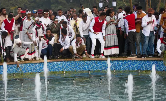 People attend the annual thanksgiving celebrations in Addis Ababa, Ethiopia, Saturday, Oct 4, 2025. (AP Photo/Amanuel Birhane)