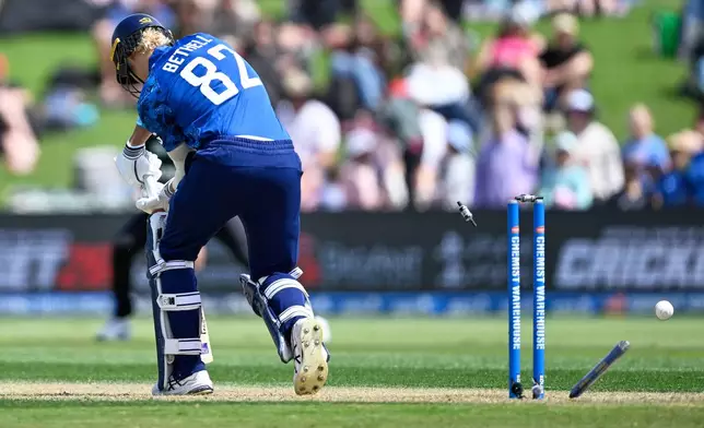 England batsman Jacob Bethell is out bowled by New Zealand's Zak Foulkes during the One Day international cricket match between New Zealand and England in Mt Maunganui, New Zealand, Sunday, Oct.26, 2025. (Andrew Cornaga/Photosport via AP)