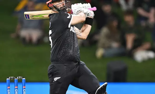 New Zealand's Daryl Mitchell bats during the One Day international cricket match between New Zealand and England in Mt Maunganui, New Zealand, Sunday, Oct.26, 2025. (Andrew Cornaga/Photosport via AP)