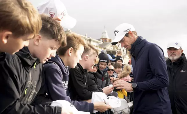 Andy Murray signs autographs following his final round during day four of the 2025 Alfred Dunhill Links Championship at the Old Course, St Andrews, Scotland, Sunday, Oct. 5, 2025. (Jane Barlow/PA via AP)