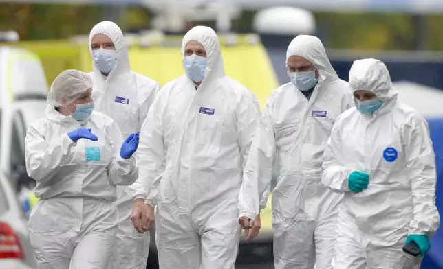 Forensic teams work at the scene of a stabbing incident that took place on Thursday, at Heaton Park Hebrew Congregation synagogue, in Manchester, England, Friday, Oct. 3, 2025. (AP Photo/Ian Hodgson)