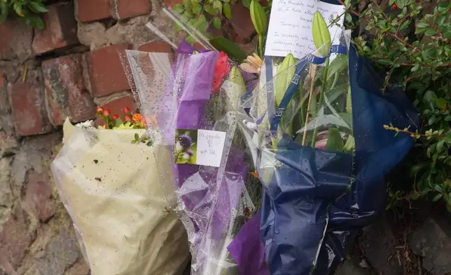 Flowers laid near by the scene of a stabbing incident at Heaton Park Hebrew Congregation synagogue, in Crumpsall, Manchester, England, Friday, Oct. 3, 2025. (AP Photo/Ian Hodgson)