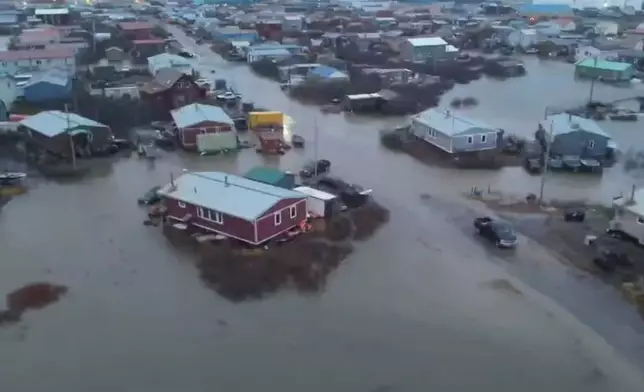 In this aerial photo provided by the Alaska Department of Transportation and Public Facilities, the city of Kotzebue, Alaska, experiences flooding, Wednesday, Oct. 8, 2025. (Alaska Department of Transportation and Public Facilities via AP)