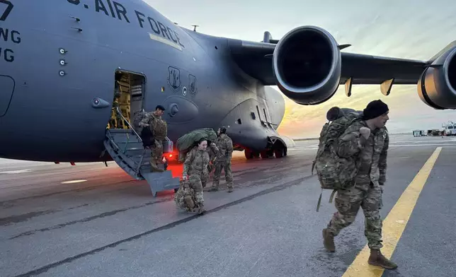 In this photo provided by Alaska National Guard, members of the Alaska National Guard arrive in Kotzebue, Alaska, Monday, Oct. 13, 2025, to support operations responding to the damage caused by Typhoon Halong. (Alaska National Guard via AP)