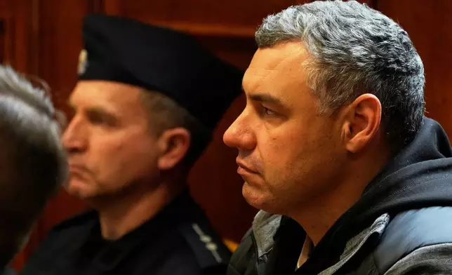 Ukrainian defendant Volodymyr Zuravlov listens as a judge announces the decision not to allow for extradition to Germany in courtroom of Warsaw's Regional Court in Warsaw, Poland, Friday, Oct. 17, 2025. (AP Photo/Czarek Sokolowski)