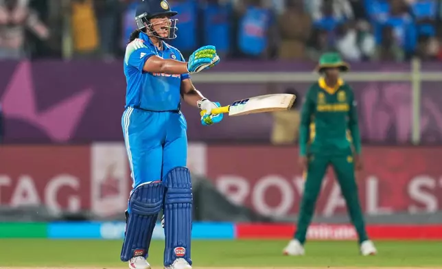 India's Richa Ghosh reacts to her batting partner as she is caught by South Africa's Chole Tryon during the ICC Women's Cricket World Cup match between India and South Africa at ACA-VDCA Cricket Stadium in Visakhapatnam, India, Thursday, Oct. 9, 2025. (AP Photo/Aijaz Rahi)