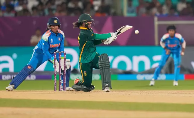 South Africa's Chole Tryon plays a shot during the ICC Women's Cricket World Cup match between India and South Africa at ACA-VDCA Cricket Stadium in Visakhapatnam, India, Thursday, Oct. 9, 2025. (AP Photo/Aijaz Rahi)
