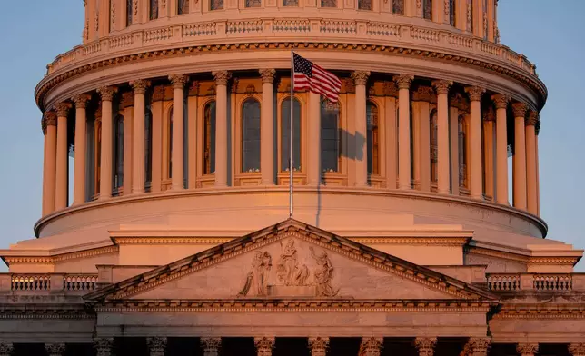 The Capitol is illuminated at dawn in Washington, Monday, Oct. 6, 2025. (AP Photo/J. Scott Applewhite)