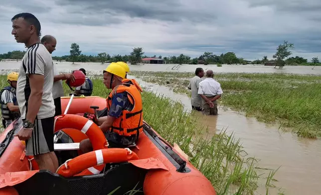 Nepalese army personnel get ready to rescue survivors after a flood in Jhapa district east of Nepal, Sunday, Oct. 5, 2025. (Nepal Army via AP)
