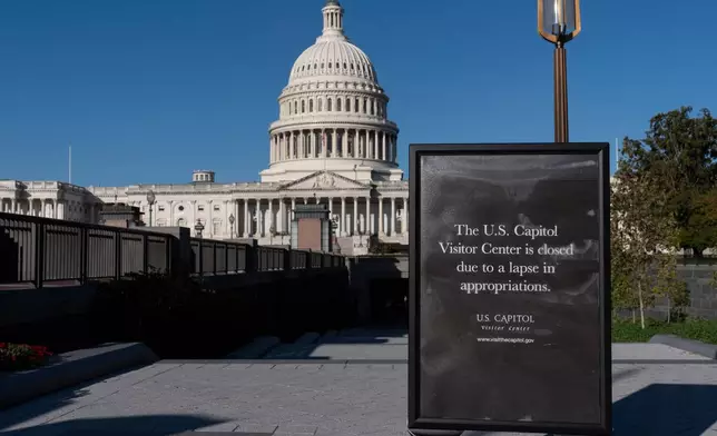 With the government shutdown now in its third week, a sign turns away tourists at the entrance to the Capitol Visitor Center, in Washington, Wednesday, Oct. 15, 2025. (AP Photo/J. Scott Applewhite)