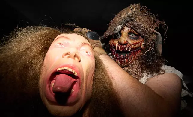 Shayne Powell, of Wixom, poses for a portrait at the Erebus Haunted House Oct. 2, 2025, in Pontiac, Mich. (AP Photo/Ryan Sun)