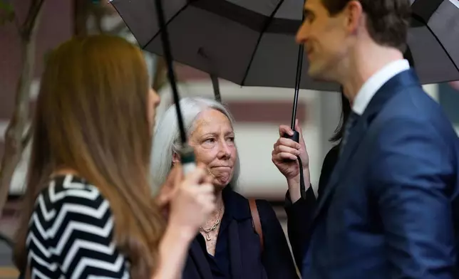 Patrice Failor, wife of former FBI Director James Comey, arrives outside federal court in Alexandria, Va., Wednesday, Oct. 8, 2025. (AP Photo/Alex Brandon)