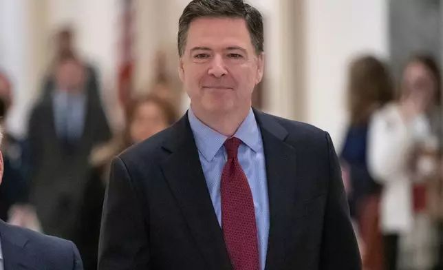 FILE - Former FBI Director James Comey, arrivex to testify under subpoena behind closed doors before the House Judiciary and Oversight Committee on Capitol Hill in Washington, Dec. 7, 2018. (AP Photo/J. Scott Applewhite, File)