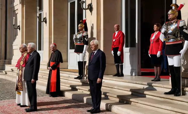 Italian President Sergio Mattarella, second from right, welcomes Pope Leo XIV as he arrives at the Quirinale Presidential Palace in Rome, Tuesday, Oct. 14, 2025. (AP Photo/Gregorio Borgia)