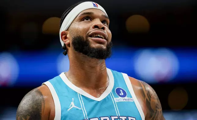 Charlotte Hornets forward Miles Bridges (0) looks to the video board during the first half of an NBA basketball preseason game against the Dallas Mavericks in Dallas, Saturday, Oct. 11, 2025. (AP Photo/Gareth Patterson)