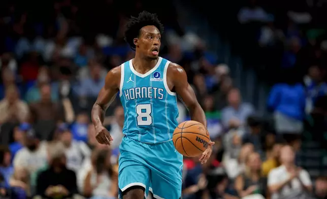 Charlotte Hornets guard Collin Sexton (8) advances the ball down court during the second half of an NBA basketball preseason game against the Dallas Mavericks in Dallas, Saturday, Oct. 11, 2025. (AP Photo/Gareth Patterson)