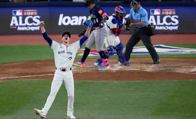 Toronto Blue Jays pitcher Jeff Hoffman celebrates after the final out of the ninth inning in Game 7 of baseball's American League Championship Series against the Seattle Mariners, Monday, Oct. 20, 2025, in Toronto. (AP Photo/David J. Phillip)