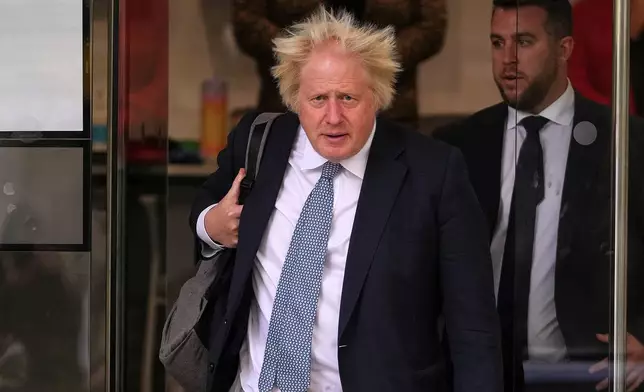 Britain's former Prime Minister Boris Johnson leaves after the COVID Inquiry at Dorland House in London, Tuesday, Oct. 21, 2025.(AP Photo/Kirsty Wigglesworth)