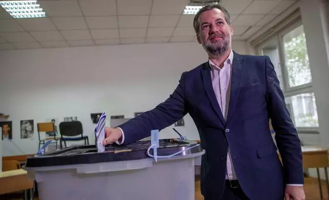 Hajrullah Ceku, candidate for the mayor from the VeteVendosje (SelfDetermination) political party casts his ballot on Sunday's municipal elections in Pristina, Kosovo on Sunday, Oct. 12, 2025.(AP Photo/Visar Kryeziu)