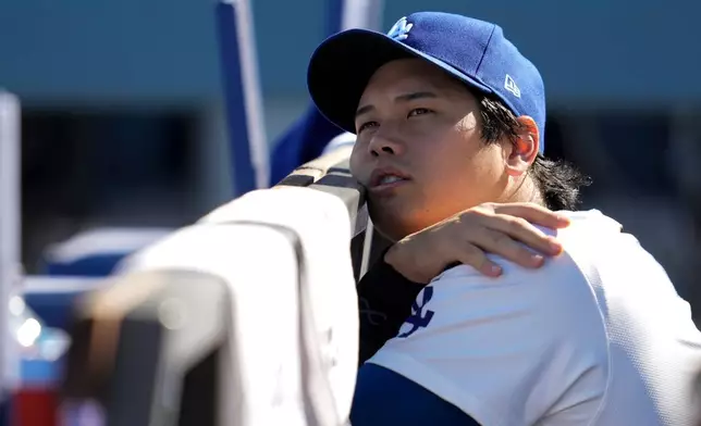Los Angeles Dodgers' Shohei Ohtani wait for the start of Game 3 of baseball's National League Championship Series between the Milwaukee Brewers and the Los Angeles Dodgers, Thursday, Oct. 16, 2025, in Los Angeles. (AP Photo/Ashley Landis)