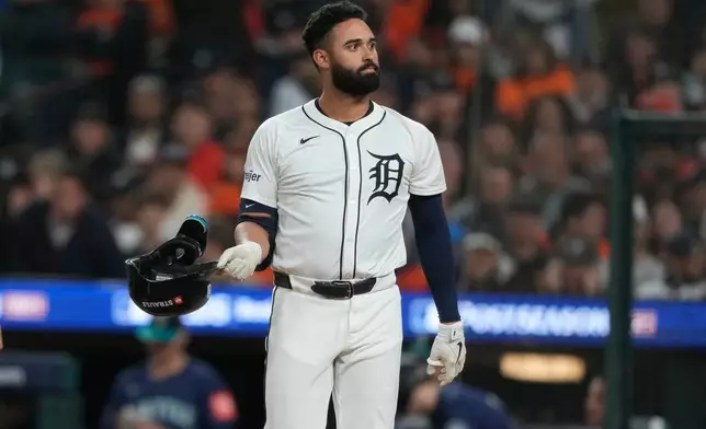Detroit Tigers' Riley Greene drops his helmet after striking out to end the first inning in Game 3 of baseball's American League Division Series against the Seattle Mariners Tuesday, Oct. 7, 2025, in Detroit. (AP Photo/Ryan Sun)