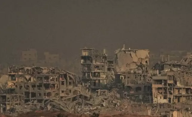 Buildings that were destroyed during the Israeli ground and air operations stand in the northern Gaza Strip, as seen from southern Israel, Thursday, Oct. 9, 2025, following the announcement that Israel and Hamas have agreed to the first phase of a peace plan to pause the fighting. (AP Photo/Ariel Schalit)