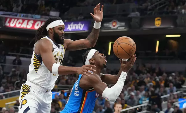Oklahoma City Thunder's Shai Gilgeous-Alexander (2) is fouled by Indiana Pacers' Isaiah Jackson during the first half of an NBA basketball game, Thursday, Oct. 23, 2025, in Indianapolis. (AP Photo/Darron Cummings)