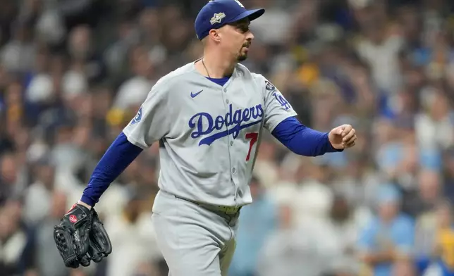 Los Angeles Dodgers pitcher Blake Snell celebrates the end of the eighth inning against the Milwaukee Brewers in Game 1 of baseball's National League Championship Series, Monday, Oct. 13, 2025, in Milwaukee. (AP Photo/Ashley Landis)