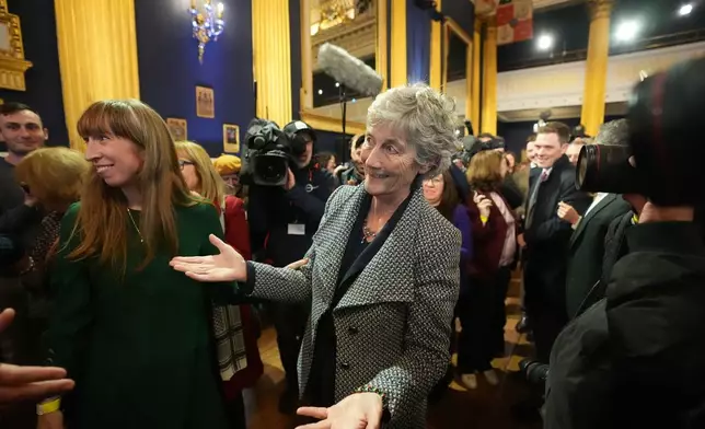 Left-wing independent presidential candidate Catherine Connolly arrives at Dublin Castle for the count in Ireland's presidential election to replace Michael D. Higgins, who has served the maximum two seven-year terms, on Saturday, Oct. 25, 2025. (Niall Carson/PA via AP)