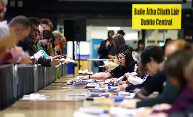 Counting gets under way after Friday's voting in the Irish presidential election at the RDS, Dublin, Ireland, Saturday, Oct. 25, 2025. (AP Photo/Peter Morrison)