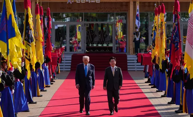 President Donald Trump and South Korean President Lee Jae Myung walk in a welcome ceremony at the Gyeongju National Museum in Gyeongju, South Korea, Wednesday, Oct. 29, 2025. (AP Photo/Mark Schiefelbein)