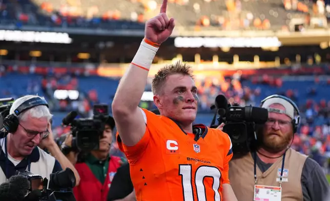 Denver Broncos quarterback Bo Nix (10) celebrates after an NFL football game against the New York Giants in Denver, Sunday, Oct. 19, 2025. (AP Photo/Jack Dempsey)