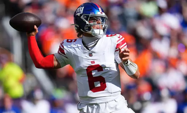 New York Giants quarterback Jaxson Dart (6) passes against the Denver Broncos during the first half of an NFL football game in Denver, Sunday, Oct. 19, 2025. (AP Photo/Jack Dempsey)