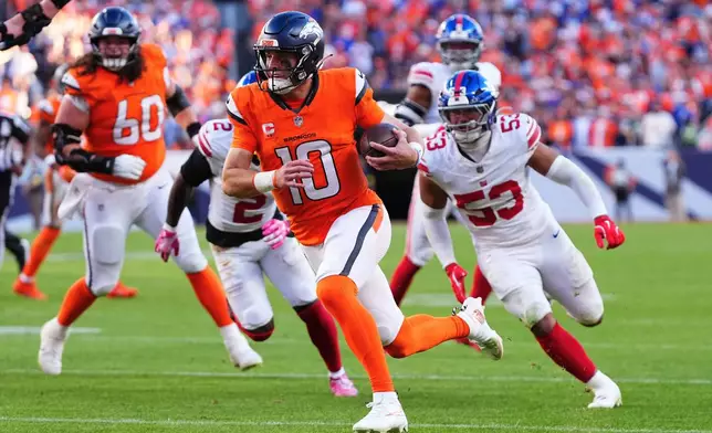 Denver Broncos quarterback Bo Nix (10) runs toward the end zone to score against the New York Giants during the second half of an NFL football game in Denver, Sunday, Oct. 19, 2025. (AP Photo/Jack Dempsey)