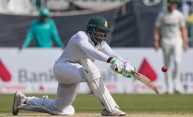 South Africa's Senuran Muthusamy plays a shot during the third day of the second test cricket match between Pakistan and South Africa, in Rawalpindi, Pakistan, Wednesday, Oct. 22, 2025. (AP Photo/Anjum Naveed)
