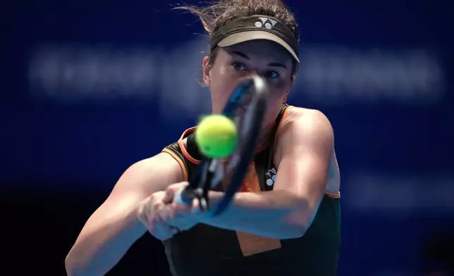 Czech Republic's Linda Noskova plays a shot against Switzerland's Belinda Bencic during the women's singles final at the Pan Pacific Open WTA 500 tennis tournament at Ariake Coliseum, in Tokyo, Sunday, Oct. 26, 2025. (AP Photo/Louise Delmotte)