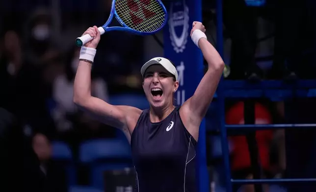 Switzerland's Belinda Bencic celebrates after winning against Czech Republic's Linda Noskova in the final match of the Pan Pacific Open women's tennis tournament at Ariake Coliseum, in Tokyo, Sunday, Oct. 26, 2025. (AP Photo/Louise Delmotte)